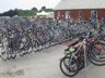 Bike parking area with Bike Newport Executive Director Bari Freeman (waiving), Folk Festival 2014