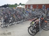 Bike parking area with Bike Newport Executive Director Bari Freeman (waiving), Folk Festival 2014