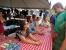 Greeting performers at the artist greeting table, Folk Festival 2015