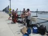 Impromptu buskers outside the entrance to the Folk Festival 2018