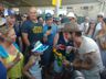 Langhorn Slim after his performance receives a sunflower from an admirer, Folk Festival 2018