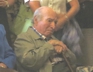 George listening intently to a band performing at a Bridgefest function at Rough Point mansion, 2013