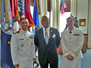 Guest (in middle) graduating from the Navy War College